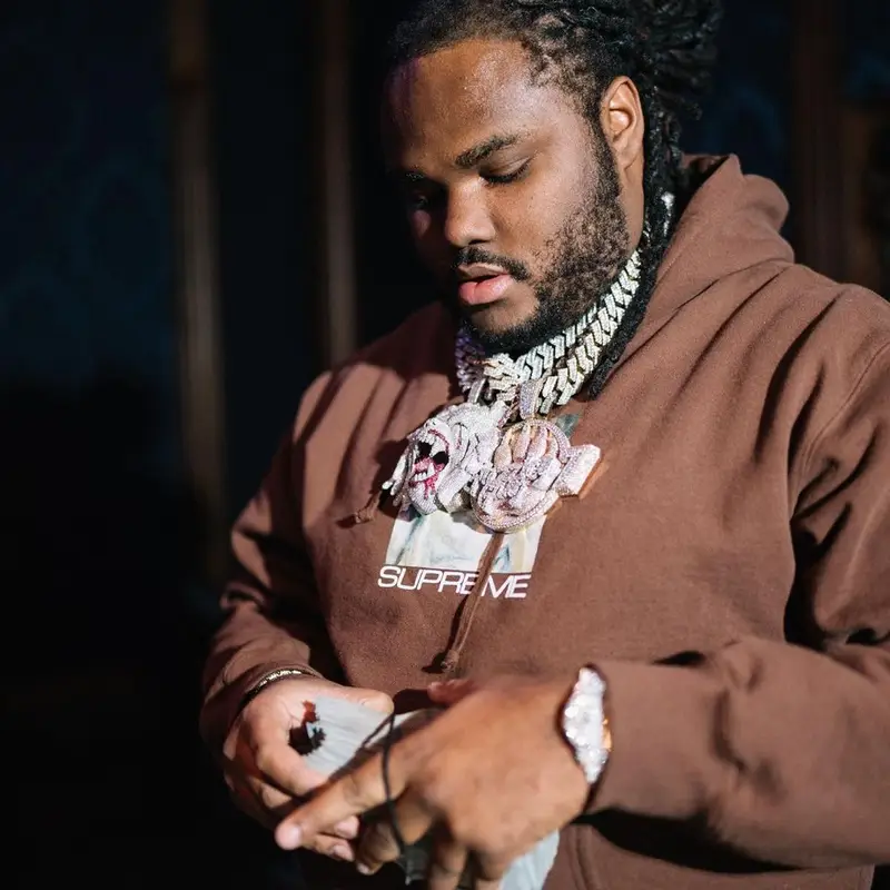 Tee Grizzley outfit in Supreme, Amiri, and Nike, 2021