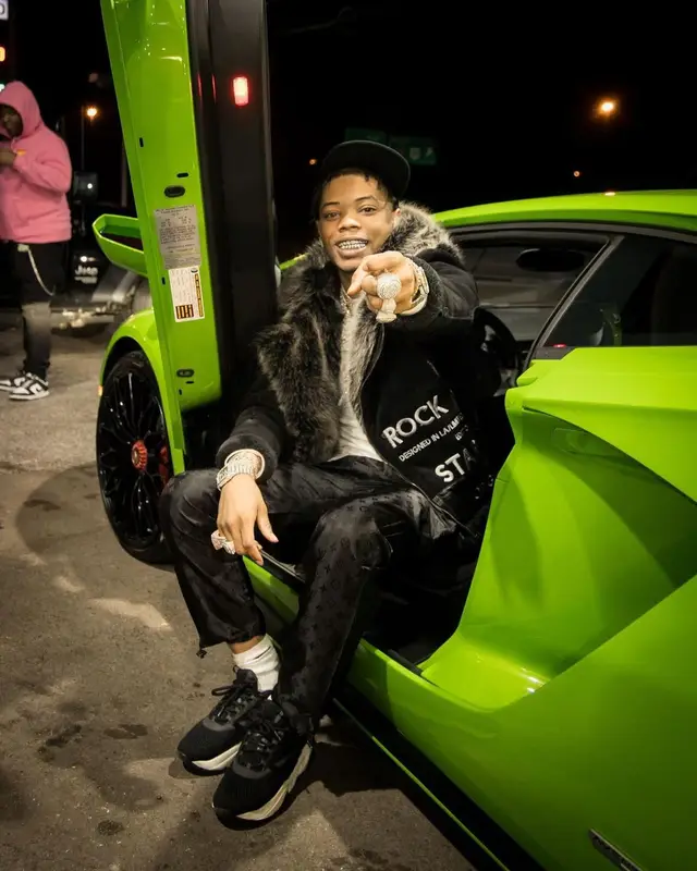 Lil Migo outfit in Rockstar Original, Louis Vuitton, and Nike, 2021