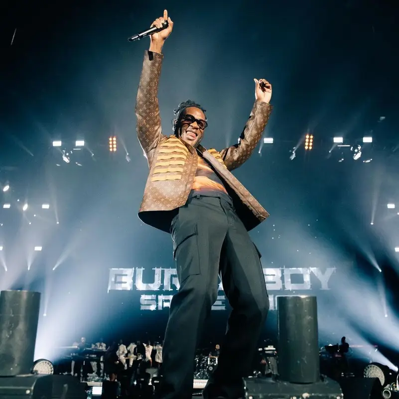 Burna Boy outfit in Louis Vuitton, Bottega Veneta, and Balenciaga, 2021