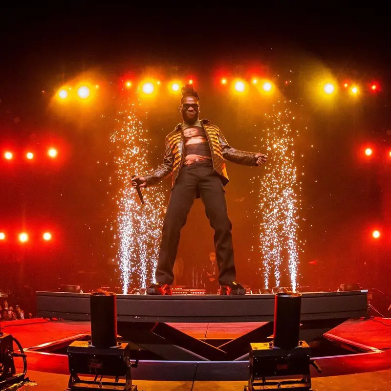 Burna Boy outfit in Louis Vuitton, Bottega Veneta, and Balenciaga, 2021