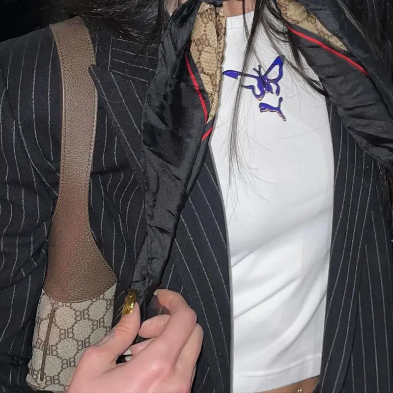Dua Lipa outfit in Le Specs, Mowalola, and Adam Selman, 2021