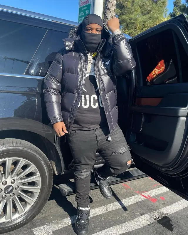 Maxo Kream outfit in Moncler, Gucci, and Louis Vuitton, 2021
