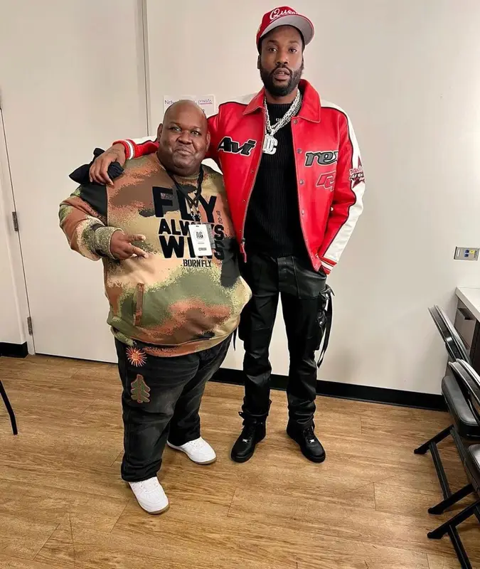 Meek Mill outfit in Avirex, Amiri, and New Era, 2021