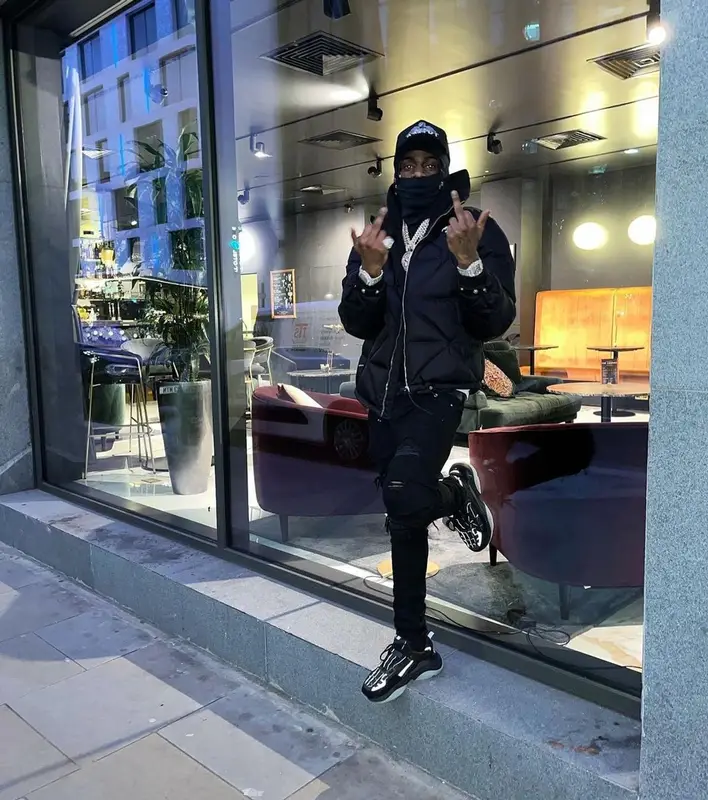 Russ Millions outfit in Prada, Louis Vuitton, and Amiri, 2021