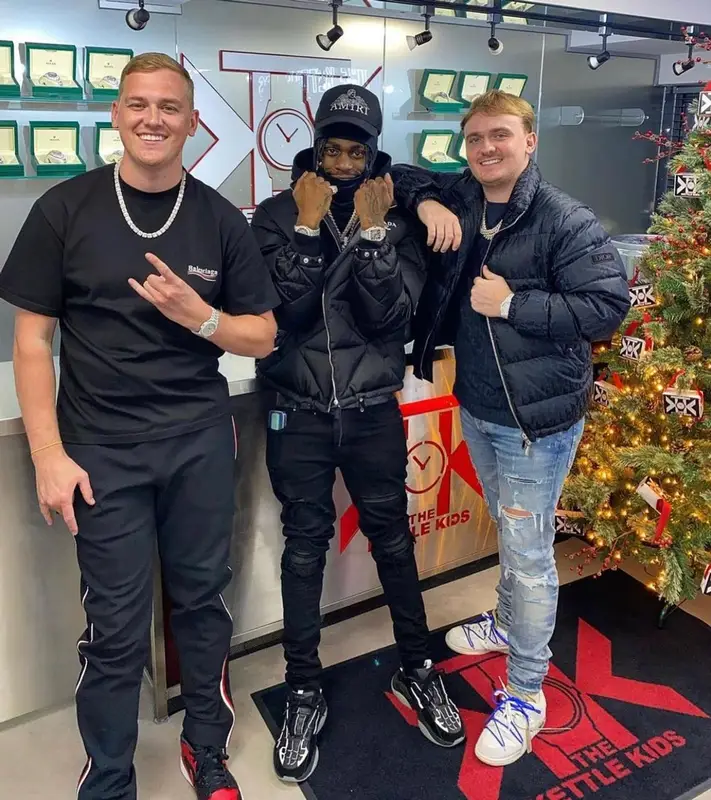 Russ Millions outfit in Prada, Louis Vuitton, and Amiri, 2021