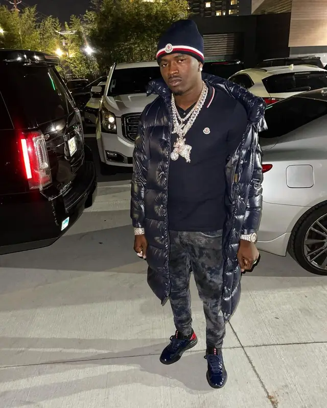 Bankroll Freddie outfit in Purple Brand, Prada, and Moncler, 2021