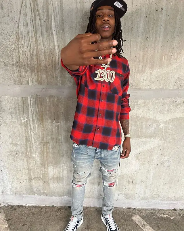 Polo G outfit in Amiri, Prada, and New Era, 2021