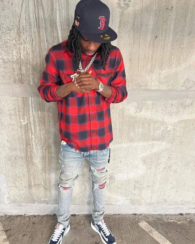 Polo G outfit in Amiri, Prada, and New Era, 2021