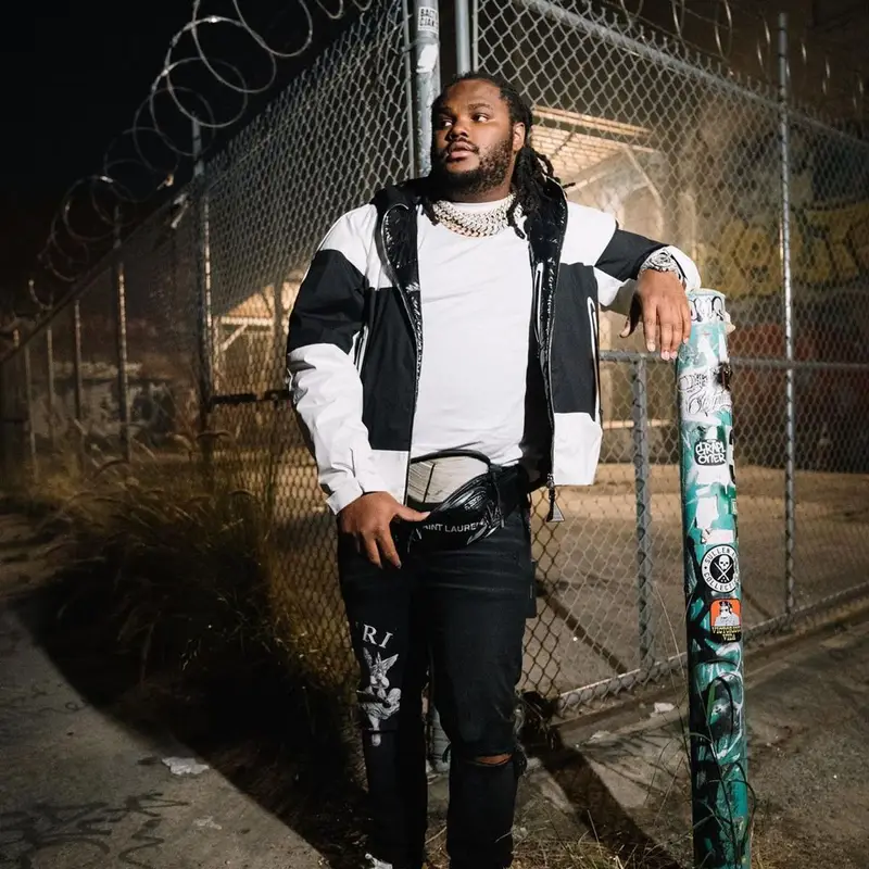 Tee Grizzley outfit in Moncler, Amiri, and Saint Laurent, 2021