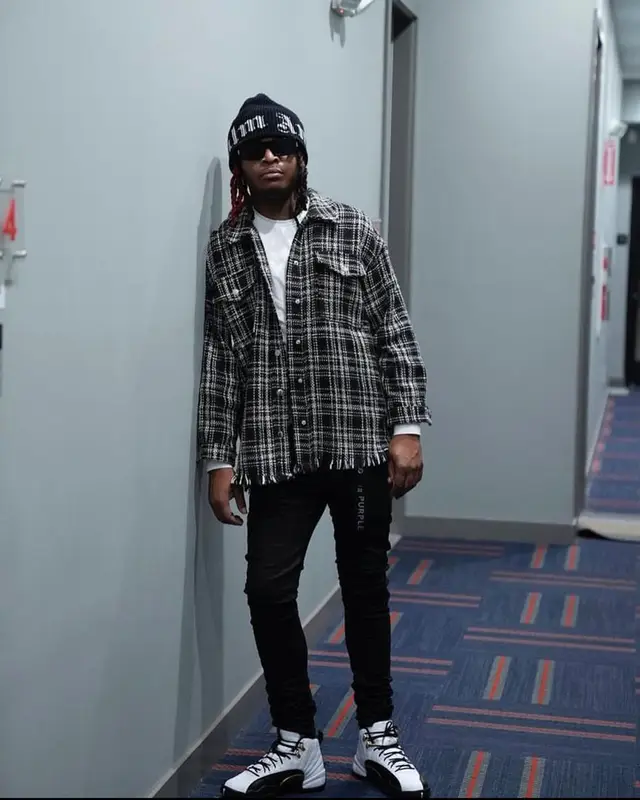 Lil Keed outfit in Purple Brand, Jordan, and Palm Angels, 2021