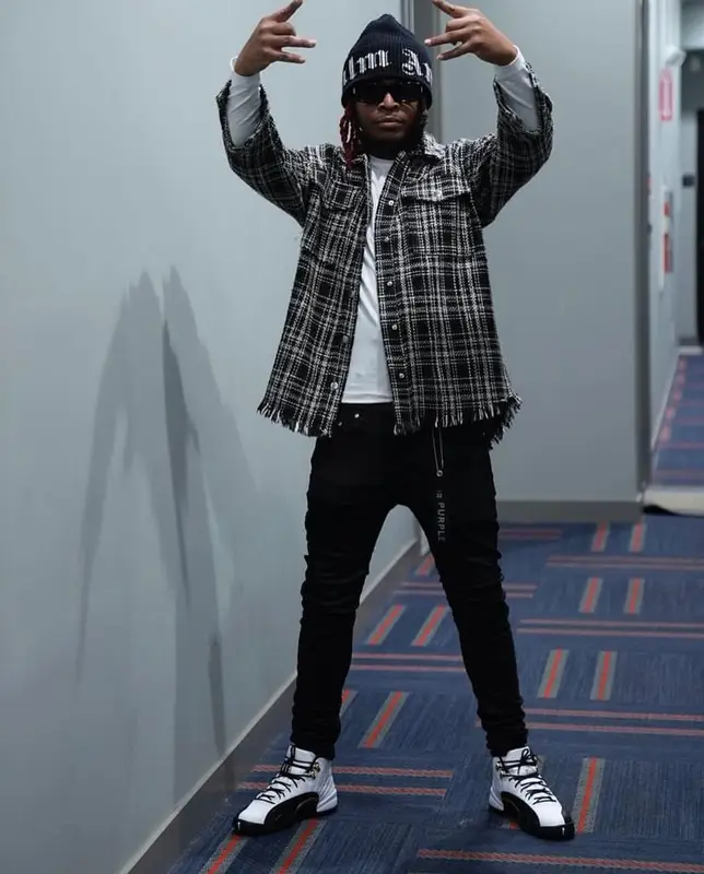 Lil Keed outfit in Purple Brand, Jordan, and Palm Angels, 2021