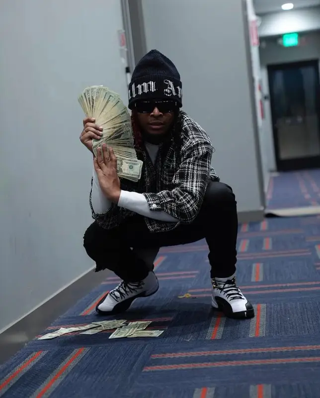 Lil Keed outfit in Purple Brand, Jordan, and Palm Angels, 2021