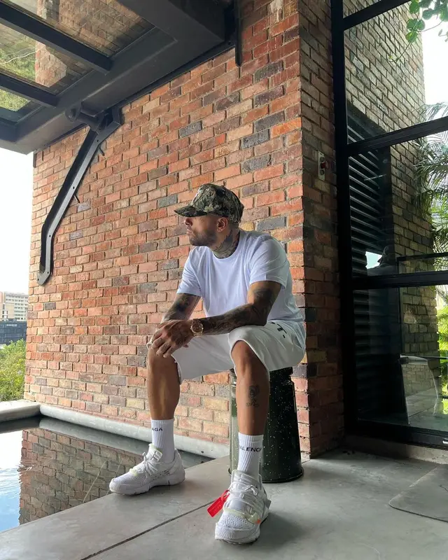 Nicky Jam outfit in Hanes, Gallery Dept., and Balenciaga, 2021