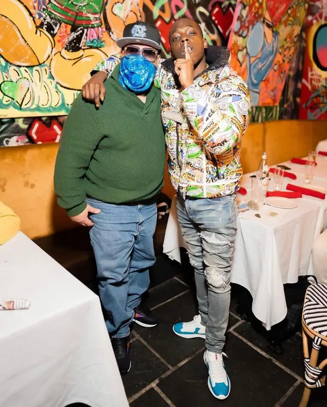 Bobby Shmurda outfit in Moncler, Amiri, and Louis Vuitton, 2021