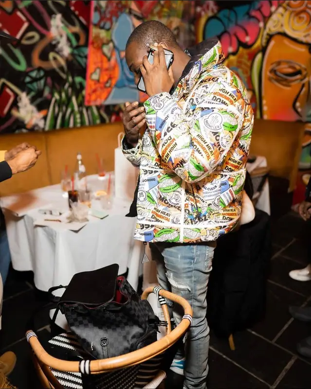 Bobby Shmurda outfit in Moncler, Amiri, and Louis Vuitton, 2021