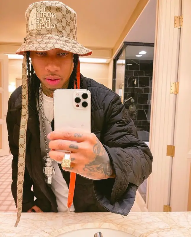 Tyga outfit in Louis Vuitton, Gucci, and The North Face, 2021
