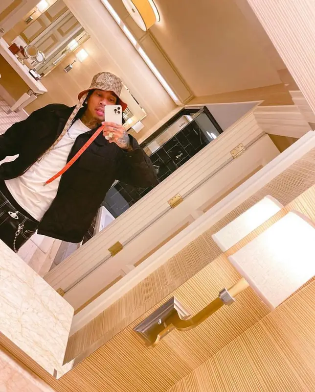 Tyga outfit in Louis Vuitton, Gucci, and The North Face, 2021