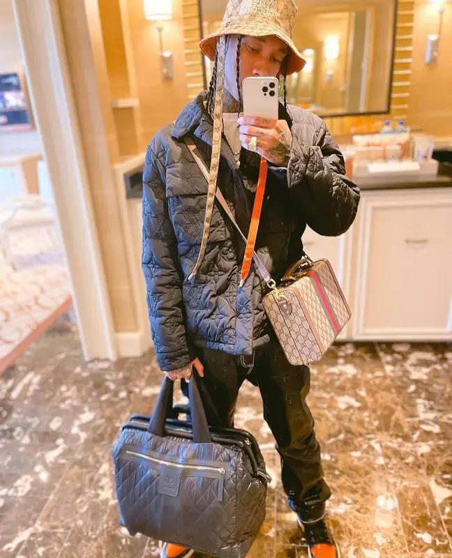 Tyga outfit in Louis Vuitton, Gucci, and The North Face, 2021