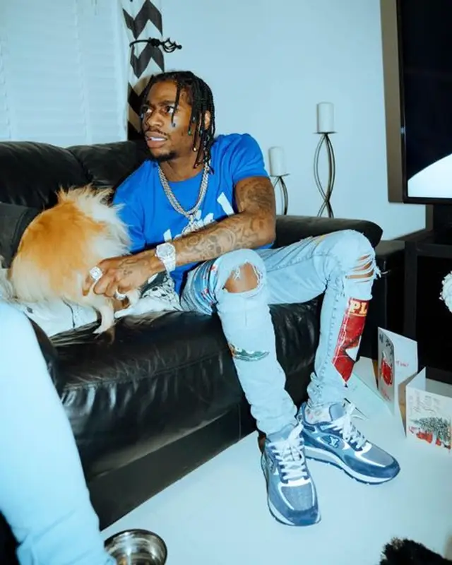 Russ Millions outfit in Dior, Louis Vuitton, and Amiri, 2021