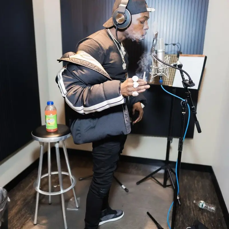 Bobby Shmurda outfit in Moncler, Louis Vuitton, and Palm Angels, 2021