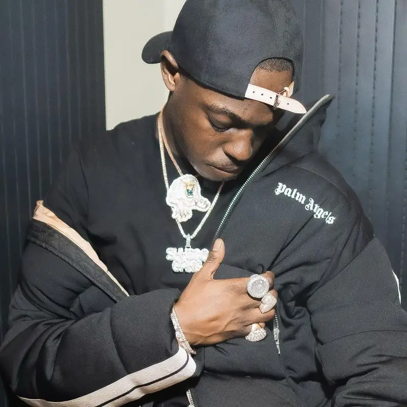 Bobby Shmurda outfit in Moncler, Louis Vuitton, and Palm Angels, 2021