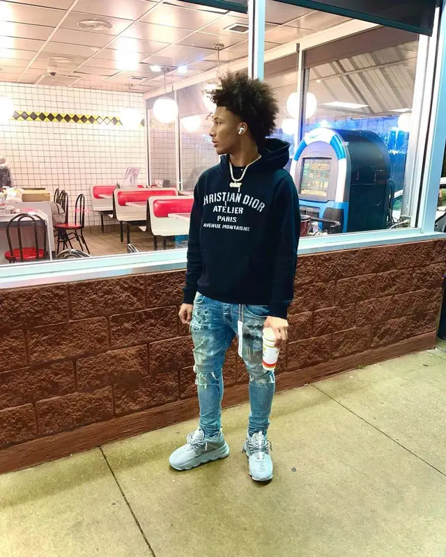 Mikey outfit in Dior, Purple Brand, and Versace, 2022