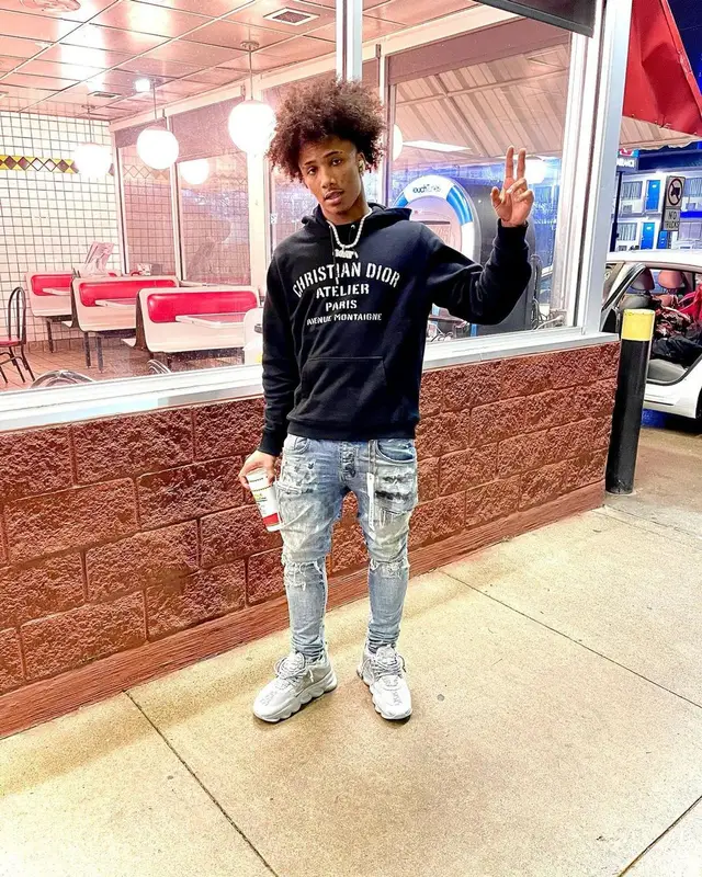 Mikey outfit in Dior, Purple Brand, and Versace, 2022