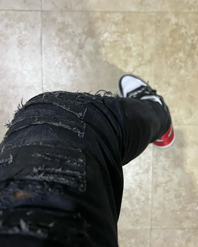 Lil Tjay outfit in Celine, Chrome Hearts, and Amiri, 2022
