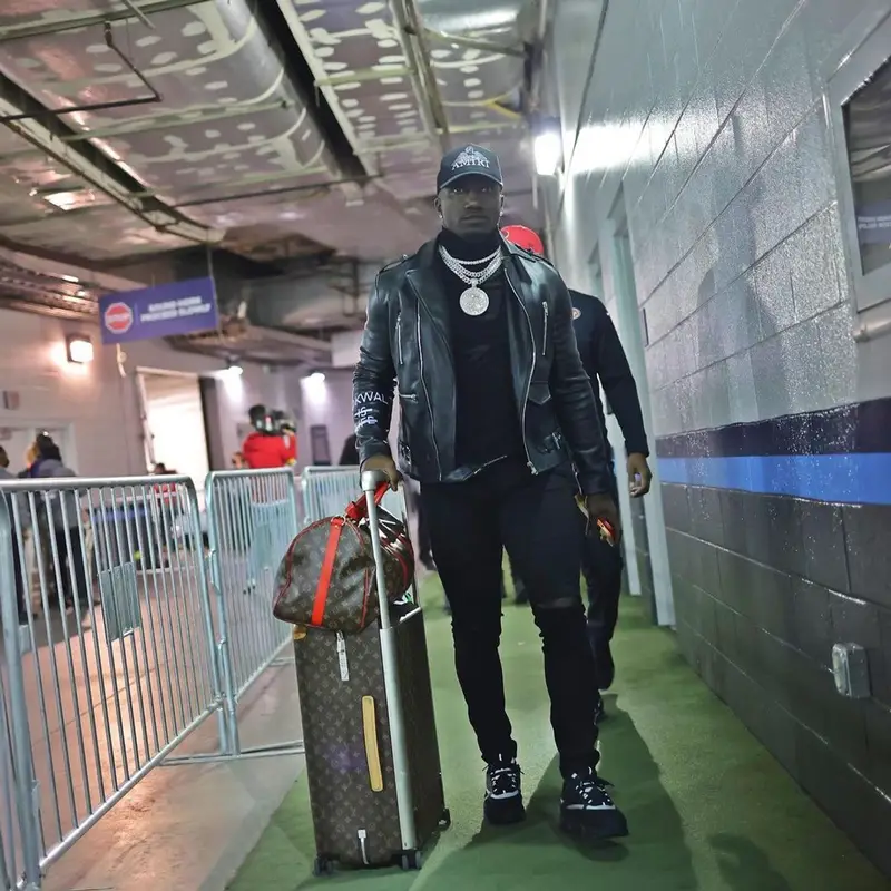 Deebo Samuel outfit in Dior, Louis Vuitton, and Amiri, 2021