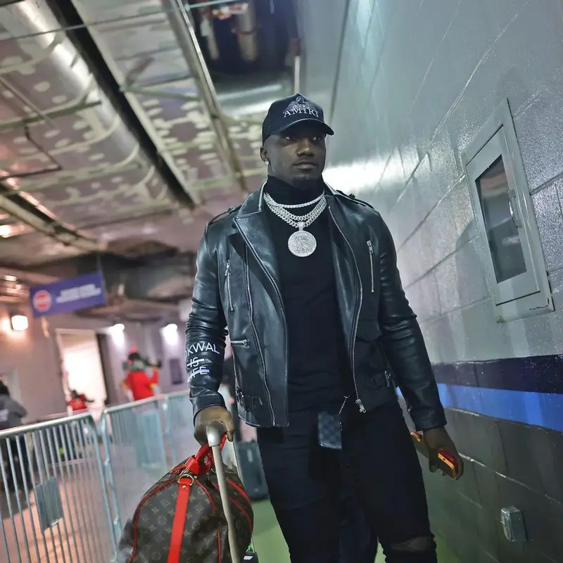 Deebo Samuel outfit in Dior, Louis Vuitton, and Amiri, 2021