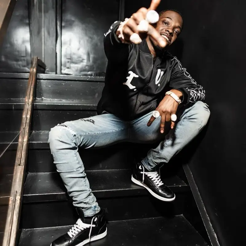 Bobby Shmurda outfit in Louis Vuitton and Amiri, 2022