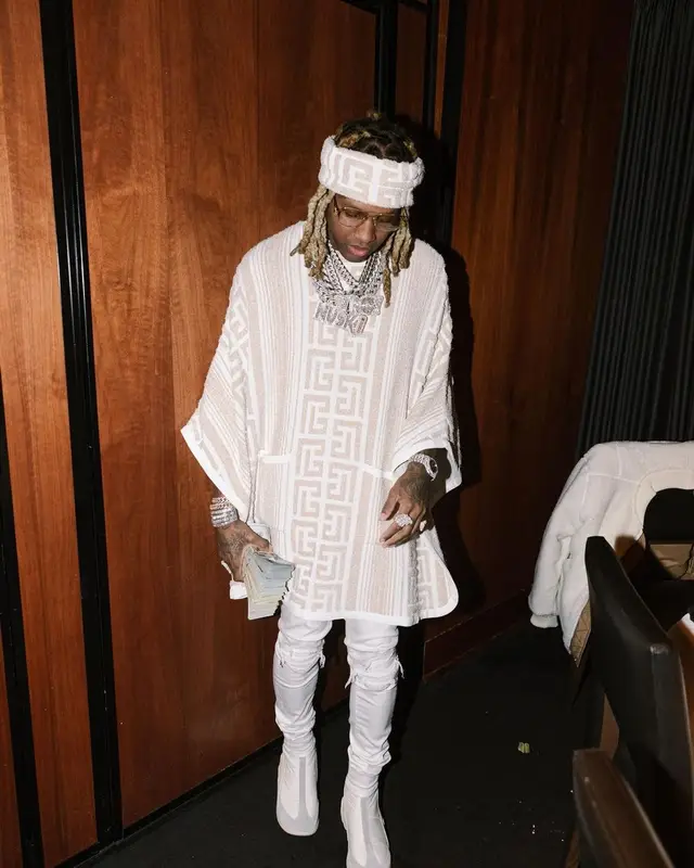 Lil Durk outfit in Balmain, Amiri, and Raf Simons, 2022