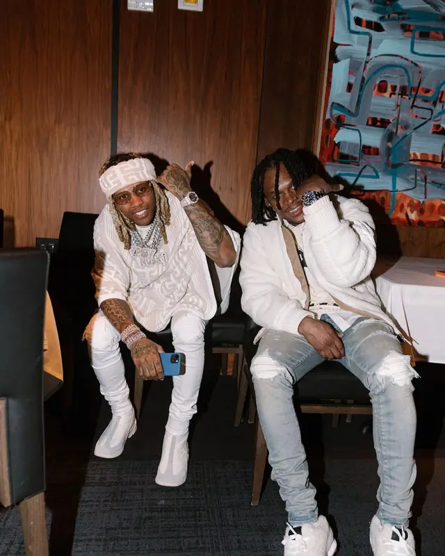 Lil Durk outfit in Balmain, Amiri, and Raf Simons, 2022