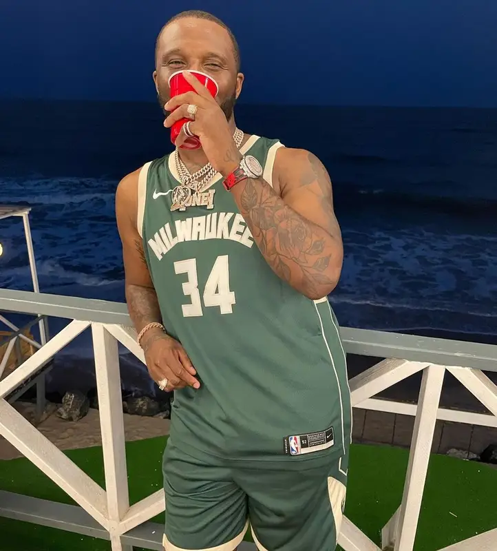 Headie One outfit in Nike, Milwaukee Bucks, and Chanel, 2022
