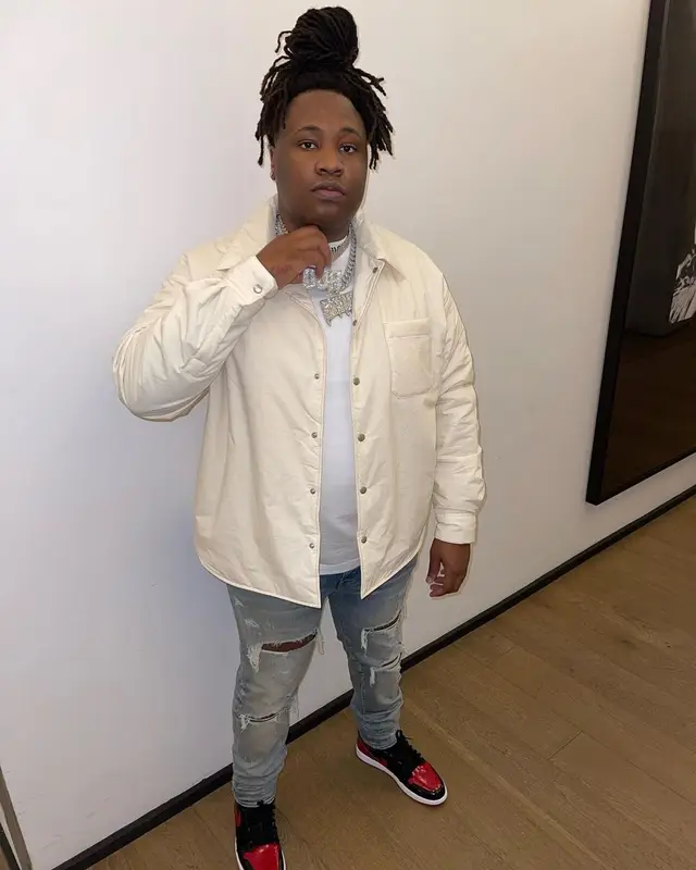 Tay Keith outfit in Palm Angels, Amiri, and Nike, 2022