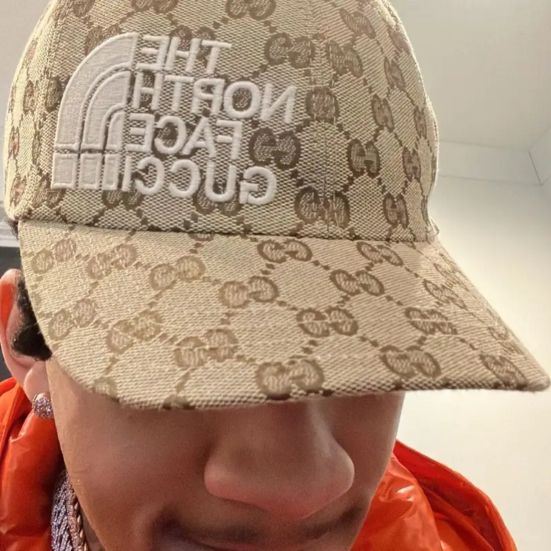 Stunna 4 Vegas outfit in Purple Brand, Gucci, and The North Face, 2022