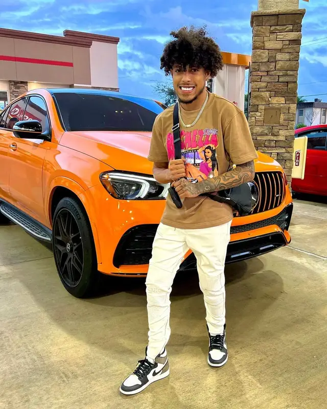 King Cid outfit in Ricchezza Forever, Nike, and Prada, 2022