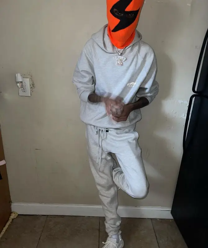 Lil Poppa outfit in Fear of God and Amiri, 2022