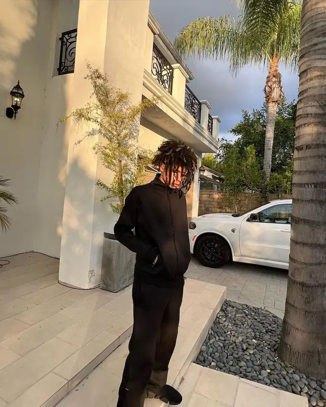 Iann Dior outfit in Louis Vuitton, Balenciaga, and MCM, 2022