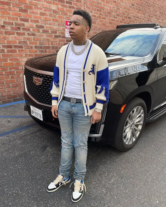 Lil Gotit outfit in Nike, Amiri, and Travis Scott Merch, 2022