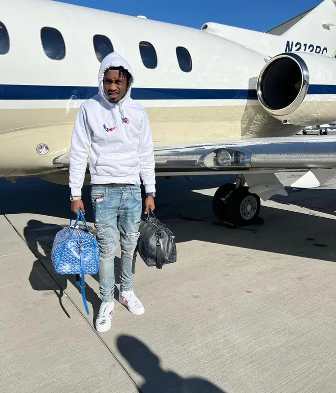 Lil Tjay outfit in Dior, Amiri, and Goyard, 2022