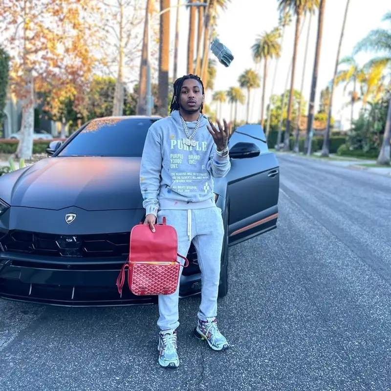 DDG outfit in Purple Brand, Balenciaga, and Goyard, 2022