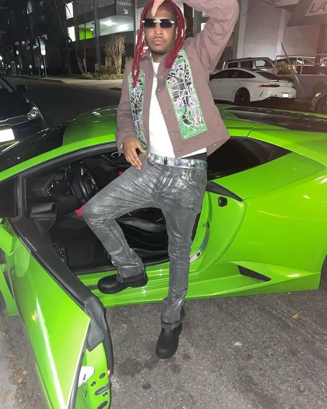 Lil Keed outfit in Who Decides War, Louis Vuitton, and James Oro, 2022