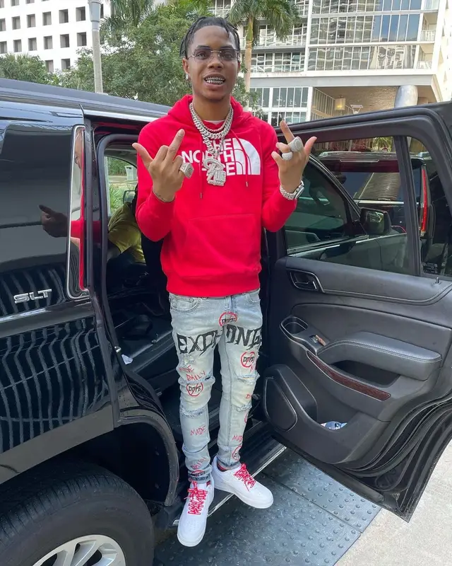 Lil Migo outfit in The North Face, Louis Vuitton, and James Oro, 2022