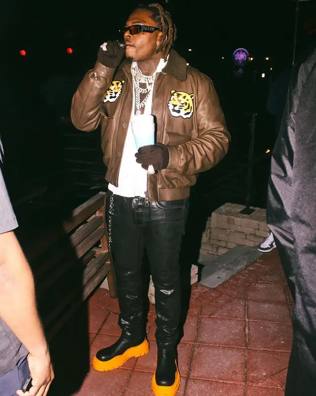 Gunna outfit in Louis Vuitton, Purple Brand, and Palm Angels, 2022