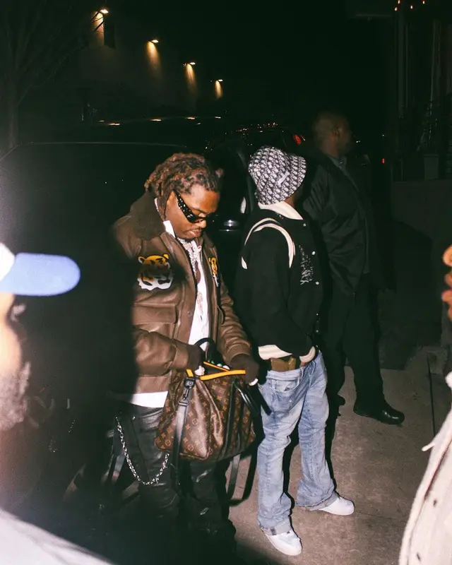 Gunna outfit in Louis Vuitton, Purple Brand, and Palm Angels, 2022