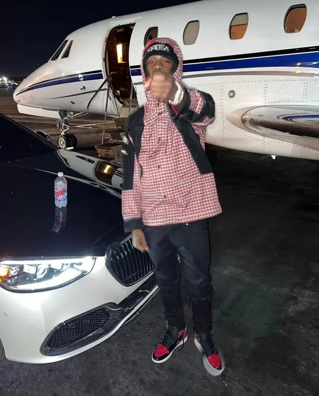 Lil Tjay outfit in The North Face, Amiri, and Supreme, 2022