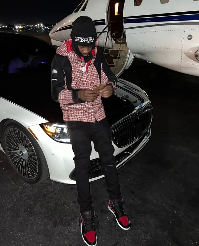 Lil Tjay outfit in The North Face, Amiri, and Supreme, 2022