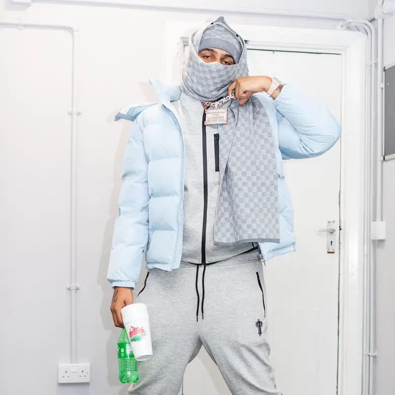 AJ Tracey outfit in Trapstar, Louis Vuitton, and Sprite, 2021