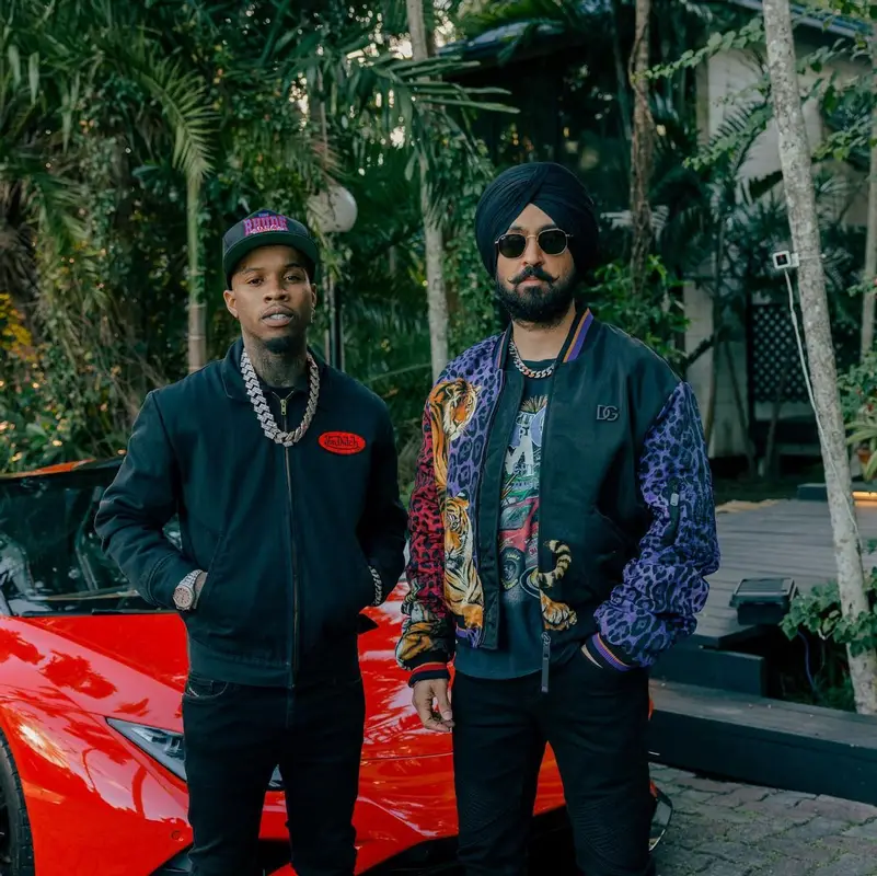 Tory Lanez outfit in Von Dutch, Amiri, and Rhude, 2022